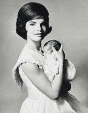 As wife of the President-Elect, Jacqueline Kennedy holds her infant son. (Richard Avedon)