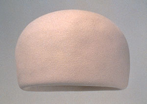 Jacqueline Kennedy's famous  Inauguration Day pillbox hat which povoked a millinery trend, now in the JFK Presidential Museum and Library.