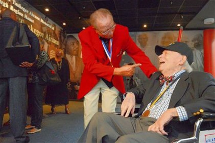 airmen1 Tuskegee Airman Robert Higginbotham, 87, left, of Palm Springs, Calif., and formerly of Sewickley, shares a laugh Thursday with Wendell Freeland, 88, of Shadyside at the Tuskegee Airmen Recognition Exhibit at Pittsburgh International Airport.