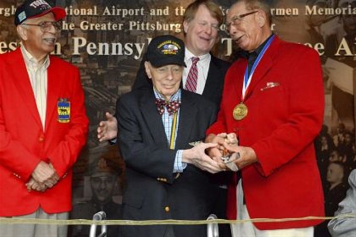 airmen2 Tuskegee airman Robert Higginbotham, 87, right, of Palm Springs, Calif., and formerly of Sewickley, shares a laugh Thursday with Allegheny County Executive Rich Fitzgerald, center rear, and fellow airmen Harry Lanauze, 87, left, of McKeesport and Wendell Freeland, 88, of Shadyside, at the Tuskegee Airmen Recognition Exhibit at Pittsburgh International Airport.