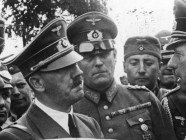 Chancellor Hitler, Commander-in-Chief, discusses with his generals the situation on the Eastern (Polish) Front.  c 1939.  (National Archives)