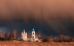 Low clouds over an old church