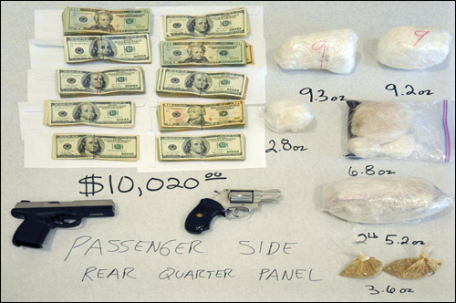 Cash, Weapons, and Drugs Seized from Gang Leader