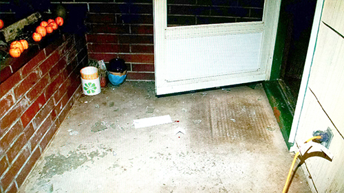 Home Invasion Victims’ Open Front Door with Glass on the Ground