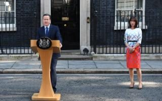 The Prime Minister, flanked by his wife, announces he will step down