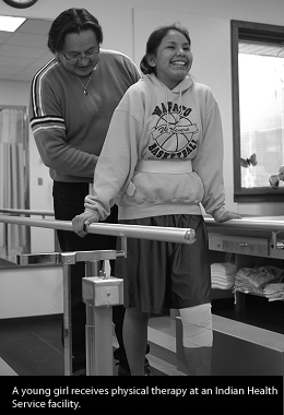 A girl training in physical therapy at an IHS facility