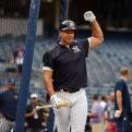 Alex Rodriguez reacts to a fan during batting practice. 

