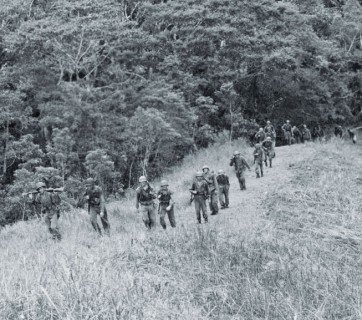 Local guides accompany the 2nd Raiders as they pursue Japanese forces across Guadalcanal in November 1942.