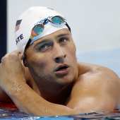 United States' Ryan Lochte checks his time in a men's 4x200-meter freestyle heat during the swimming competitions at the 2016 Summer Olympics, Tuesday, Aug. 9, 2016, in Rio de Janeiro, Brazil. 