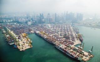 Comment: Container terminals in Singapore. The global economy is being affected by a slowdown in trading volumes, partly because politicians are increasingly imposing barriers to imports 