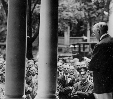 Warren G. Harden reads a speech from his front porch.