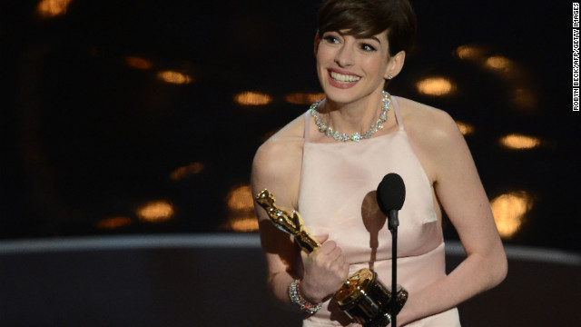 Best Supporting Actress winner Anne Hathaway addresses the audience onstage at the 85th Annual Academy Awards on February 24, 2013 in Hollywood, California. AFP PHOTO/Robyn BECK        (Photo credit should read ROBYN BECK/AFP/Getty Images)