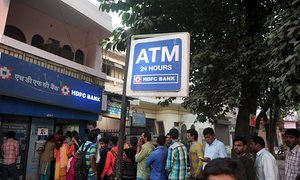 Indians queue outside a bank in Allahabad to exchange 500- and 1,000-rupee notes.