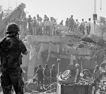 Hours after the Sunday, Oct. 23, 1983, bombing of the Marine barracks in Beirut, rescuers comb the wreckage for the wounded and dead.