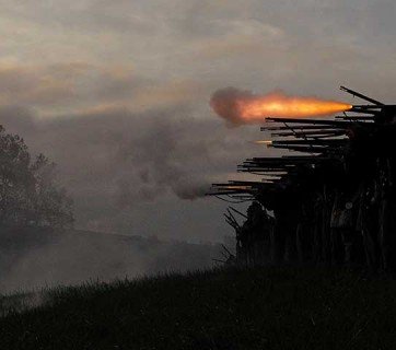 Union soldiers advance and fire on the Confederates during a sunrise reenactment in October 2012 at the Battle of Perryville’s sesquicentennial.