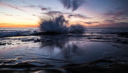 I wanted to capture the break on the rocks during high tide but as I lost light I had to leave the shutter open longer and the wave blended in motion.