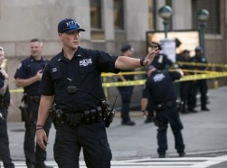 Police investigate the scene of a shooting at a federal office building in Lower Manhattan, New York, August 21, 2015