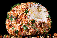 The Bits and Pieces Party Cheese Ball is rolled in chopped pecans and parsley.