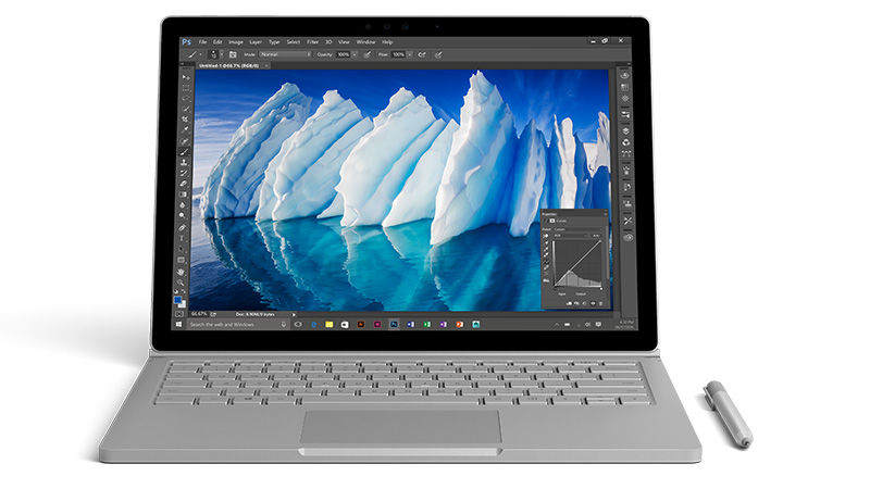 Surface Book with pen showing a high res image of an iceberg on screen.