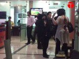 The woman slaps a female mall security official. Screen grab obtained from an Express Tribune video
