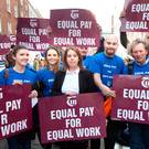 Joanne Irwin (centre) at a protest against pay inequality. Photo: Tony Gavin
