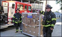 Picture of two responders preparing for the CDC’s Strategic National Stockpile CHEMPACK training