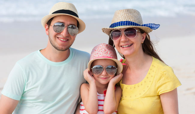 Couple with daughter at beach