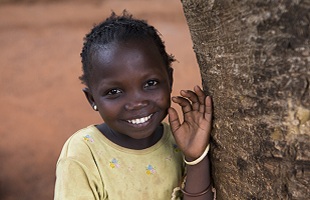 Girl from Central African Republic smiling.