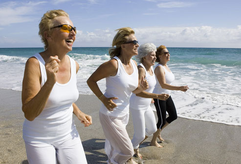 Older Women Running On Beach