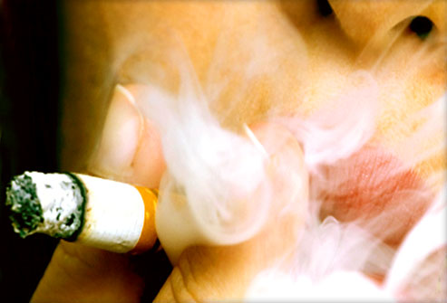 young woman smoking closeup