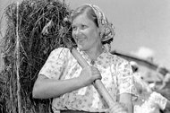 A woman working at a collective farm near Moscow in 1955.