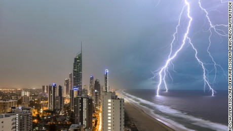 Mandatory Credit: Photo by Renee Doyle/Solent News/REX/Shutterstock (7642817a)
A dramatic lightning storm illuminates the sea as a series of bolts strike the water and hit high-rise buildings lining the coast. The storm raged for 30 minutes, as bolts of electricity ripped through the sky and torrential rain fell.
A Dramatic Storm in Queensland, Australia - 19 Dec 2016
A dramatic lightning storm illuminates the sea as a series of bolts strike the water and hit high-rise buildings lining the coast.
The storm raged for 30 minutes, as bolts of electricity ripped through the sky and torrential rain fell.

Photographer Renee Doyle was woken at around 4.30am by the ferocious storm and was able to capture the lightning from her balcony on the 34th floor of a block in Surfers Paradise, Queensland, Australia.

The storm lasted about 30 minutes and was right above her building, and Renee was forced back indoors as the lightning struck a building close by, then hit the antenna of a 322 metre-tall skyscraper called Q1.
She said: &quot;I was awoken by loud thunder and flashes of lightning at around 4.30am. The sound was incredible and the flashes of light so bright I found myself having to get out of bed to watch the storm. It was directly over us. As I got out of bed a bolt of lightning struck just outside our apartment. I quickly set up and was able to capture a few frames of the lightning bolts striking the water.&quot;

Renee Said that &quot;The lightning was extremely close and probably the largest bolts I have ever witnessed - especially this close. I&#39;ve never witnessed such a severe storm in such close proximity.
&quot;The lightning then struck a building only two residences along from us and as the rain came it was time to head inside for safety.
I set up my camera and then just hoped the lightning filled the frame. A bit of luck comes into it as you never know or can predict exactly where the lightning will strike...
For more information visit http://www.rexfeatures.com/stacklink/OEJJMVHY