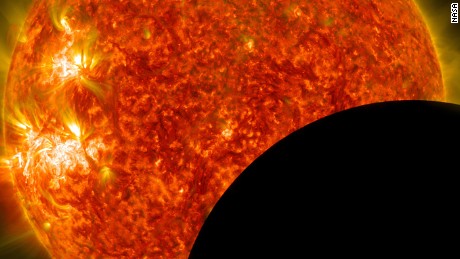 NASA image of the moon crossing in front of the sun.