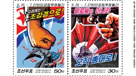 Left: This postage stamp distributed by the North Korean government to mark &quot;anti-U.S. leading forces month&quot; held between June 25-July 27, 2017, says &quot;against the strong measure with (our) stronger measure&quot;. (Korean Central News Agency/Korea News Service via AP)
Right: This postage stamp distributed by the North Korean government to mark &quot;anti-U.S. leading forces month&quot; held between June 25-July 27, 2017, says &quot;not by words, entirely by weapon (gun).&quot; (Korean Central News Agency/Korea News Service via AP)