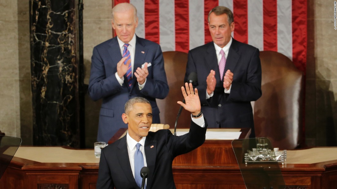 Obama acknowledges applause as he arrives to give his speech. House Speaker John Boehner of Ohio, right, and Vice President Joe Biden applaud.