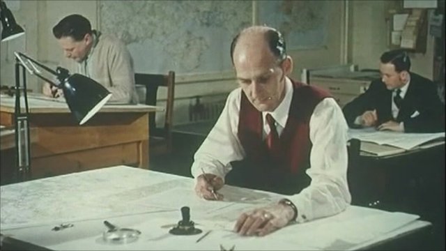 Archive pictures of men making maps