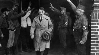 FILE - In this Dec. 5, 1931 file photo, Adolf Hitler, leader of the National Socialists, is saluted as he leaves the party's Munich headquarters. In Munich, Hitler launched his political career with speeches condemning Jews and proclaiming the ethnic superiority of Germans. (AP Photo, File)