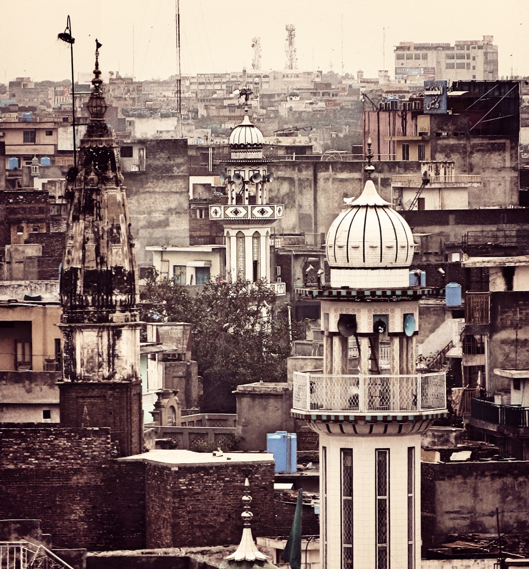 Mandir spire juxtaposed with Mosque Minar in the Bhabra bazaar neighbourhood of Old Rawalpindi.—Muhammad Bin Naveed