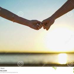close-up-two-lovers-joining-hands-detail-silhouette-man-woman-holding-hands.jpg