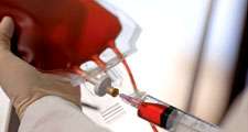 blood. Close-up of a technician drawing human blood with syringe from blood bag at a blood bank. Blood donation, Healthcare and medicine, needle