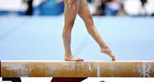 Girl on a balance beam. Gymnastics. Sports