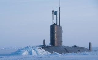 HMS Trenchant breaking through the metre-thick ice of the Arctic Ocean on an ice exercise