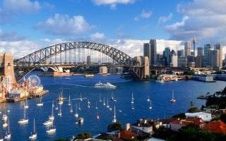 Sydney skyline with Harbour Bridge and yachts anchored in Lavender Bay