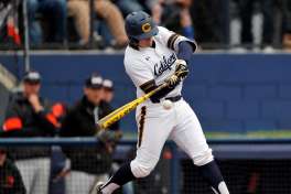 Andrew Vaughn (20) swings at a pitch as the Cal Bears played the Oregon State Beavers at Evans Field in Berkeley, Calif., on Sunday, March 18, 2018.