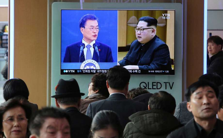 FILE - In this March 7, 2018, file photo, people watch a TV screen showing images of North Korean leader Kim Jong Un and South Korean President Moon Jae-in, left, at the Seoul Railway Station in Seoul, South Korea. Kim Jong Un will be in unchartered territory when the third-generation autocrat crosses over to the southern half of the Demilitarized Zone separating the rival Koreas on Friday, April 27, possibly on foot, and greets South Korean President Moon Jae-in. Photo: Ahn Young-joon, AP / Copyright 2018 The Associated Press. All rights reserved.