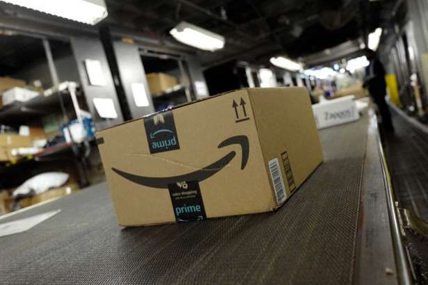 FILE- In this May 9, 2017, file photo, a package from Amazon Prime moves on a conveyor belt at a UPS facility in New York. Amazon.com Inc. reports earns on Thursday, April 26, 2018.