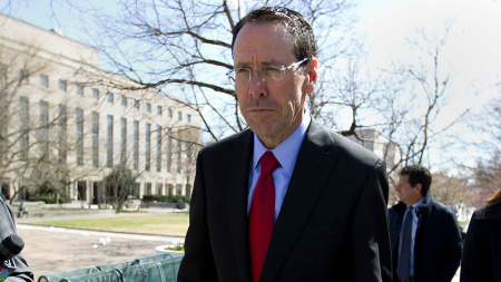 AT&T CEO Randall Stephenson leaves the