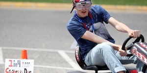 John Botteli, a junior at Woodbury High School, tries to navigate obstacles while wearing impairment simulation goggles Tuesday, May 22, 2018.