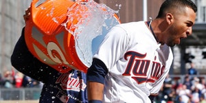 Minnesota Twins' Eddie Rosario gets a water dousing after his walkoff, two-run home run off Cleveland Indians' pitcher Cody Allen in the ninth inning 