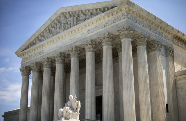 The Supreme Court building is seen in Washington. The Supreme Court, rejected an emergency appeal to stop Texas from enforcing its challenged voter ID law. But the court said it could revisit the issue as the November elections approachSupreme Court Voter ID Texas, Washington, USA
